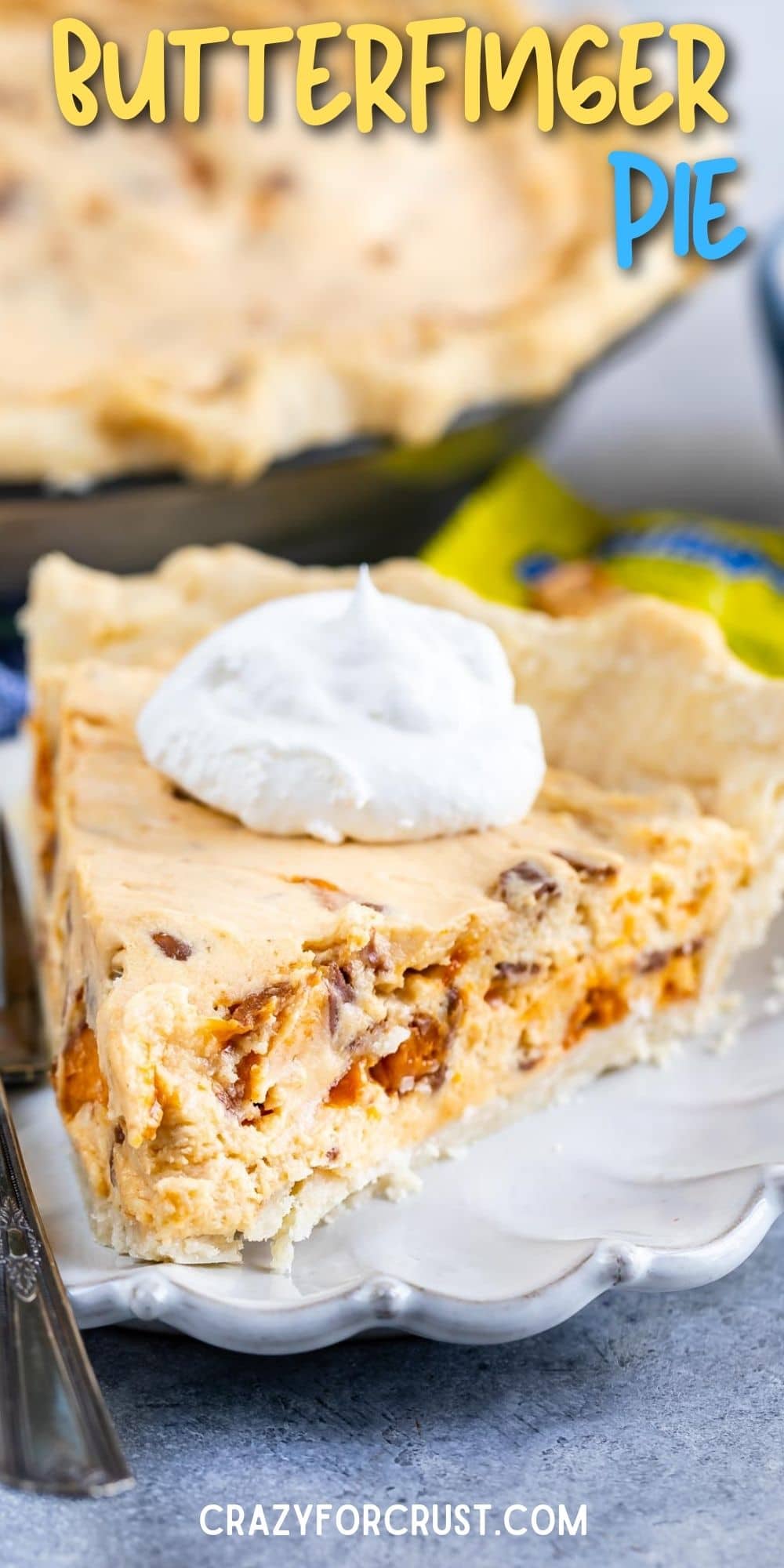 One slice of easy butterfinger pie with a dollop of whipped cream and recipe title on top of image