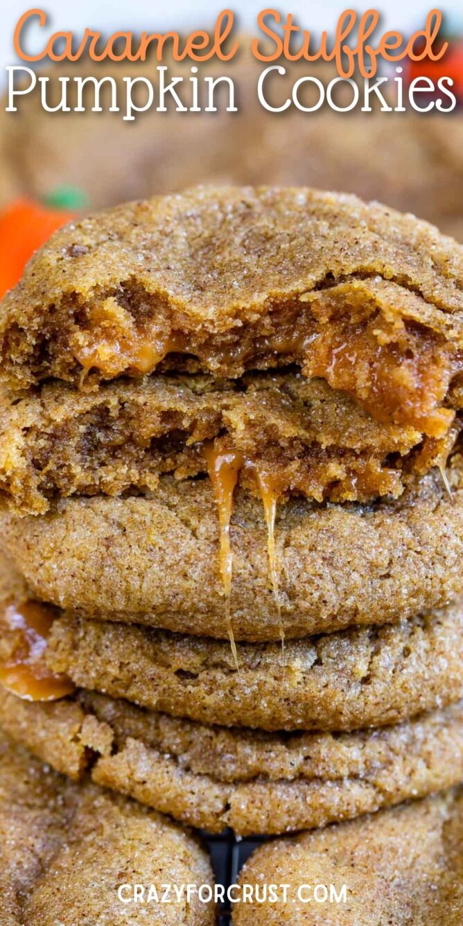 Caramel stuffed pumpkin cookies with top one cut in half to show inside caramel filling with recipe title on top of image