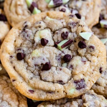 A bunch of mint chip chocolate chip cookies with recipe title on top of image