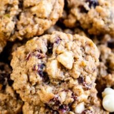 Close up shot of oatmeal cranberry cookies with recipe title on top of image
