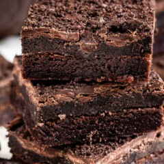 Close up shot of three Oreo truffle brownies stacked on top of eachother