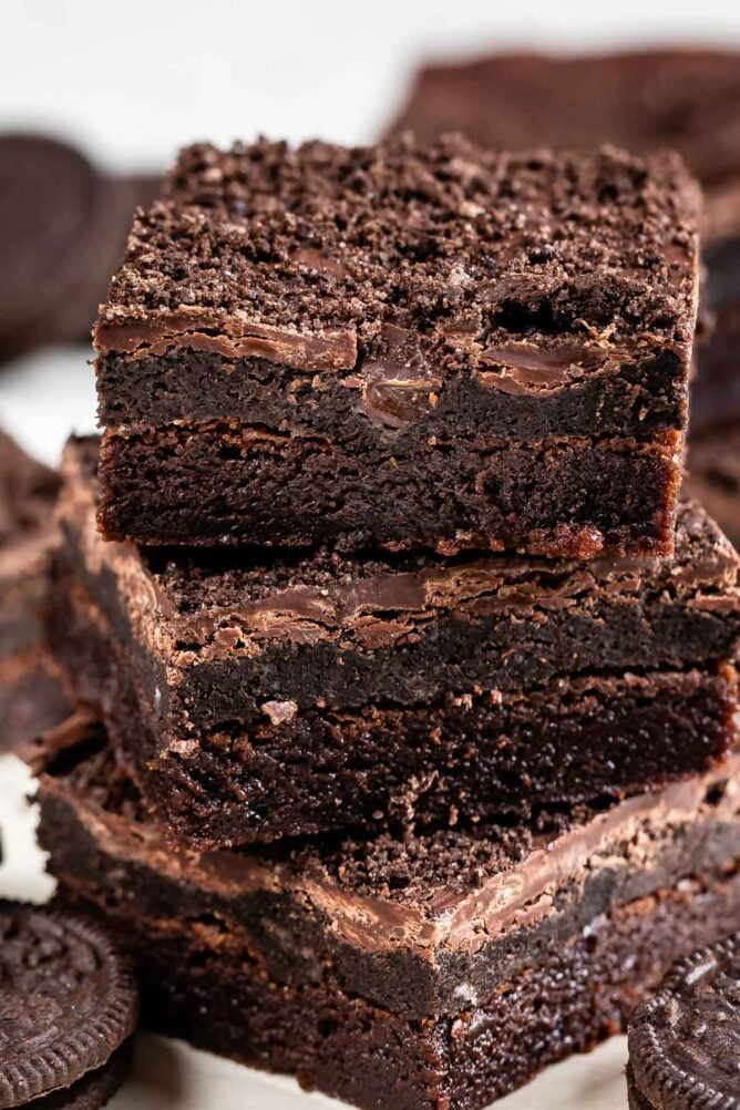 Close up shot of three Oreo truffle brownies stacked on top of eachother