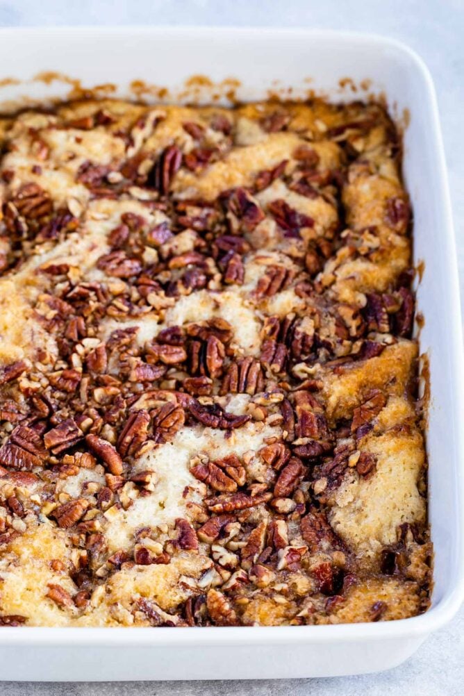 Pecan pie cobbler in a white baking dish