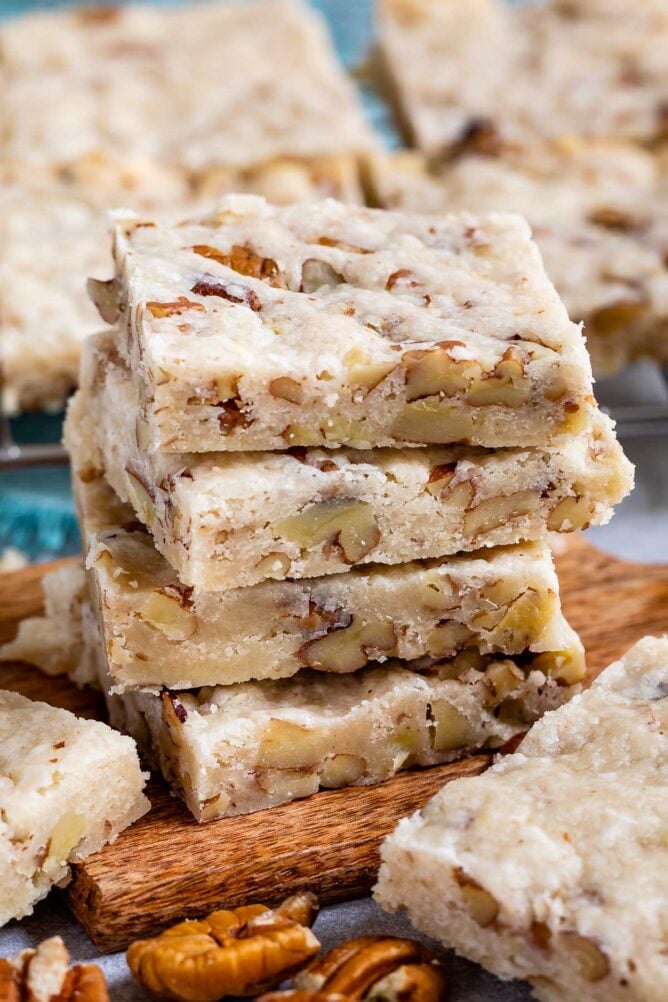 Stack of pecan shortbread cookies with more in background