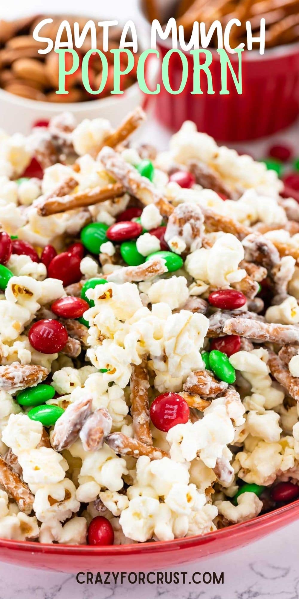 Bowl of santa munch popcorn snack mix with recipe title on top of image