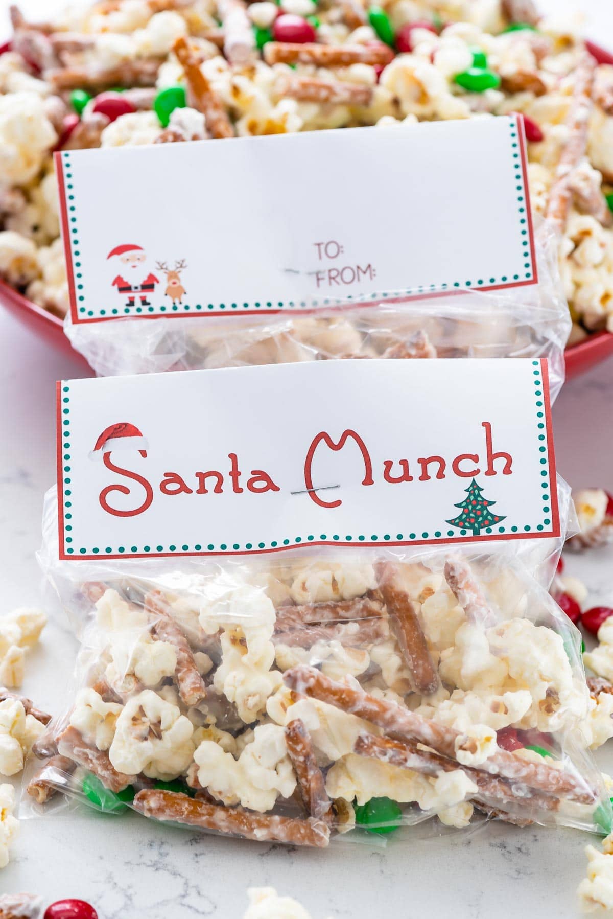 Santa munch popcorn snack mix in little clear bags with cute christmas tags