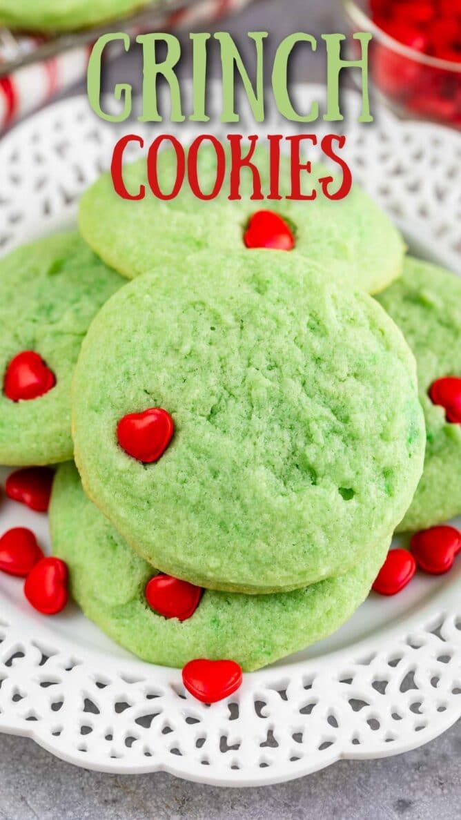 Close up photo of large stack of grinch cookies on a white plate