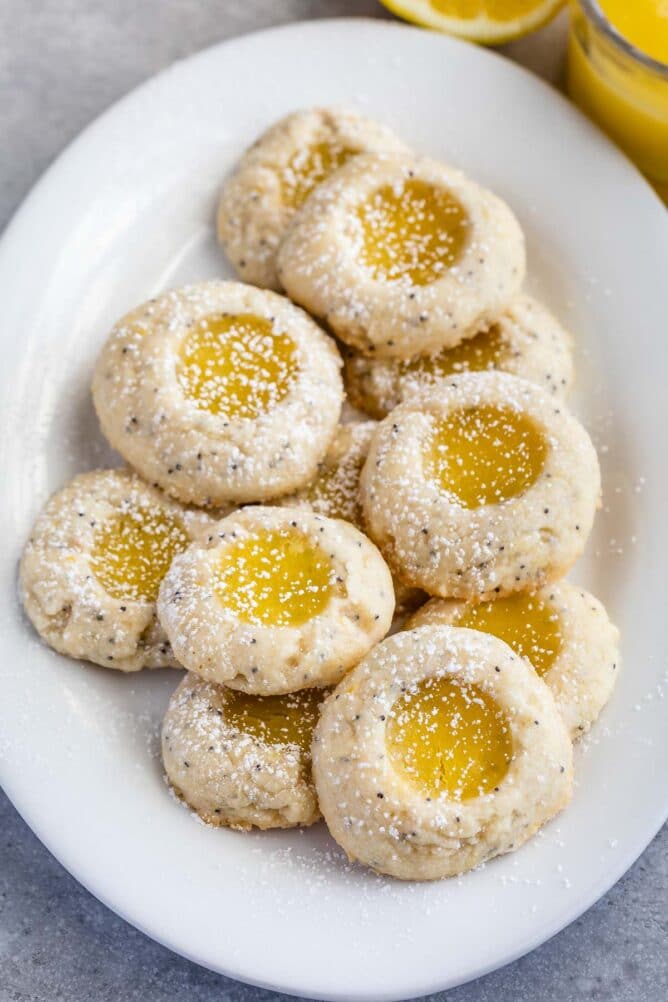 stack of thumbprint cookies on white plate