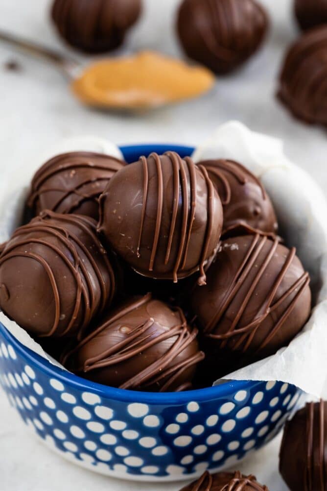 blue bowl with peanut butter balls inside