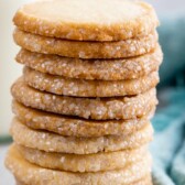 Tall stack of easy butter cookies with recipe title on top of image