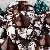 Close up shot of chocolate mint kiss crinkles with recipe title on top of image