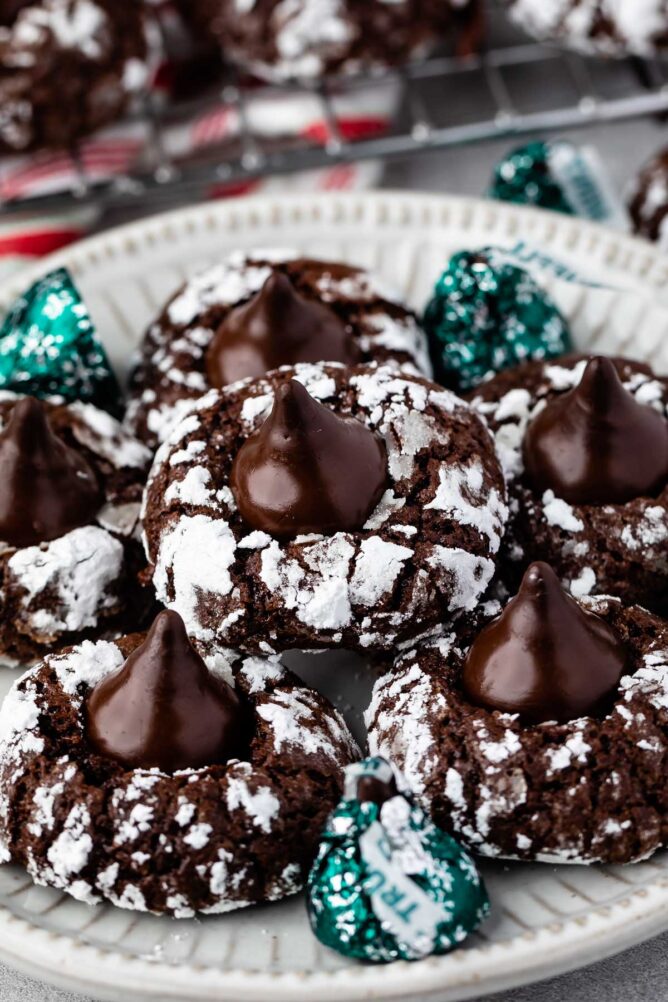 Plate full of chocolate mint kiss crinkle cookies with hershey kisses