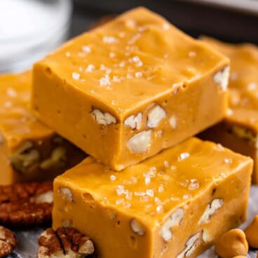 Two pieces of salted butterscotch fudge stacked on top of eachother