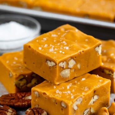 Two pieces of salted butterscotch fudge stacked on top of eachother