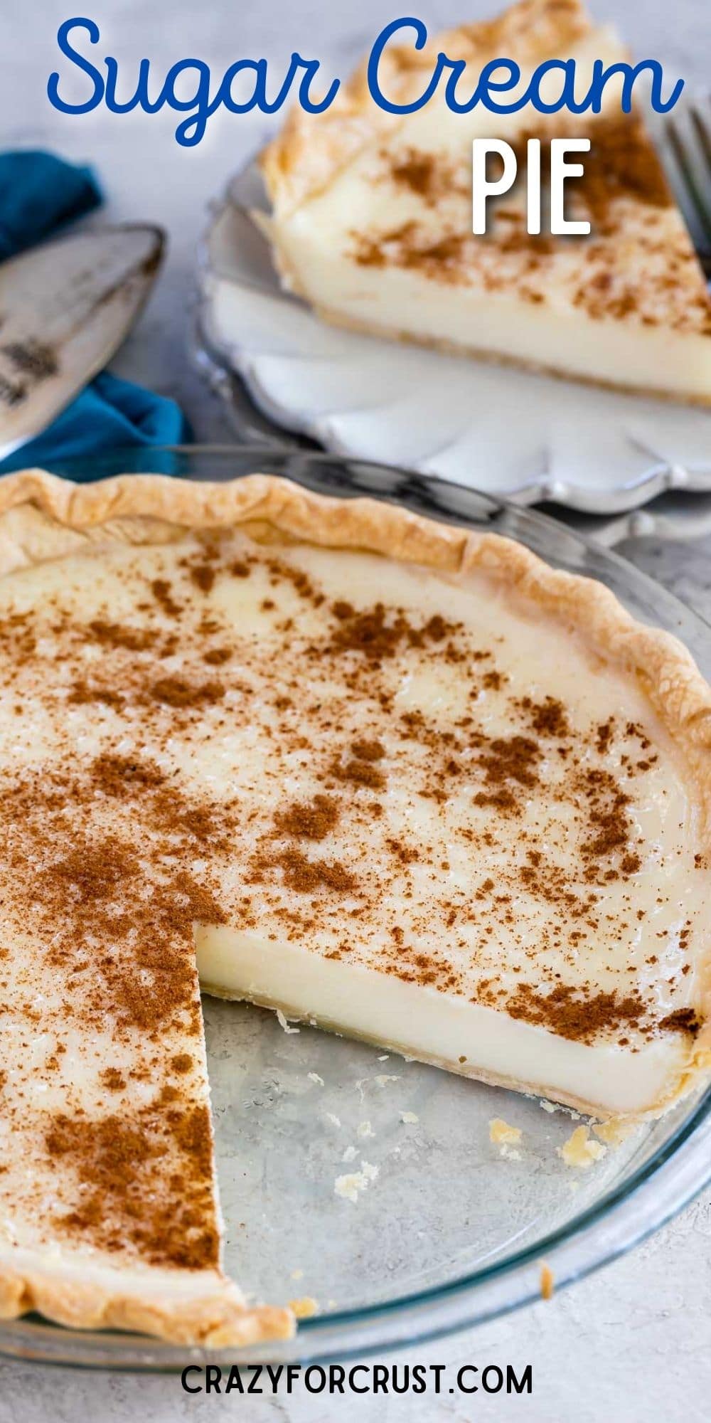 Sugar cream pie with one slice on a plate with fork behind pie and recipe title on top of image