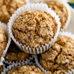 Overhead shot of Bran muffins stacked on top of one another on a plate