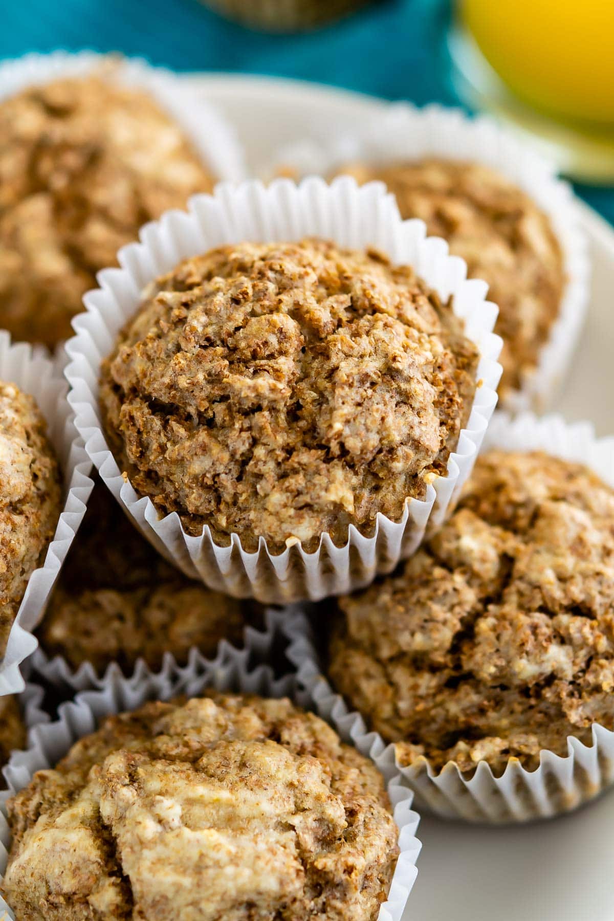 Overhead shot of Bran muffins stacked on top of one another on a plate