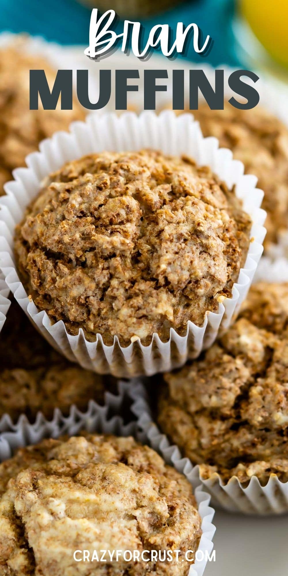 Overhead shot of Bran muffins stacked on top of one another on a plate and recipe title on top of image