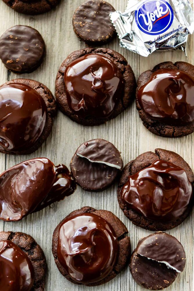 Overhead shot of double chocolate peppermint patty cookies surrounded by york peppermint patties