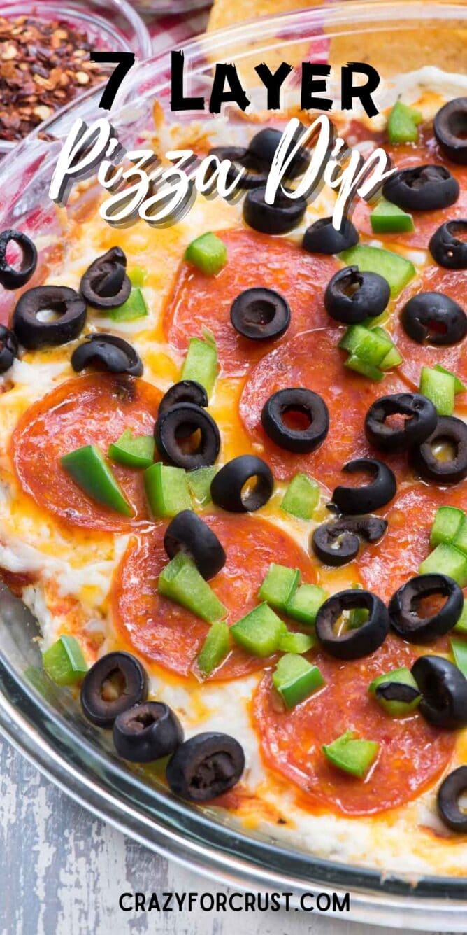 Overhead shot of 7 layer pizza dip with recipe title on top of image