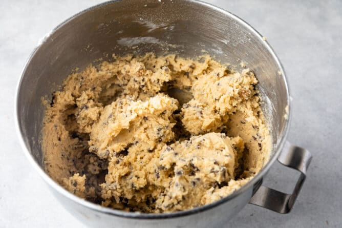 Cookie dough in a kitchenaid mixing bowl
