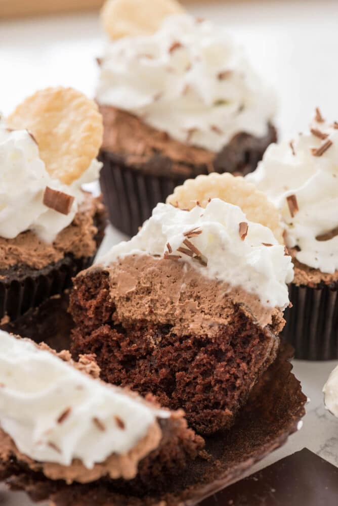 French silk cupcakes with one split in half to show inside filling