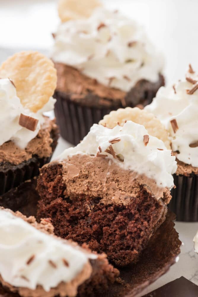 French silk cupcakes with one split in half to show inside filling