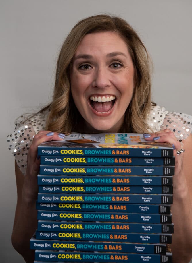 woman with stack of books