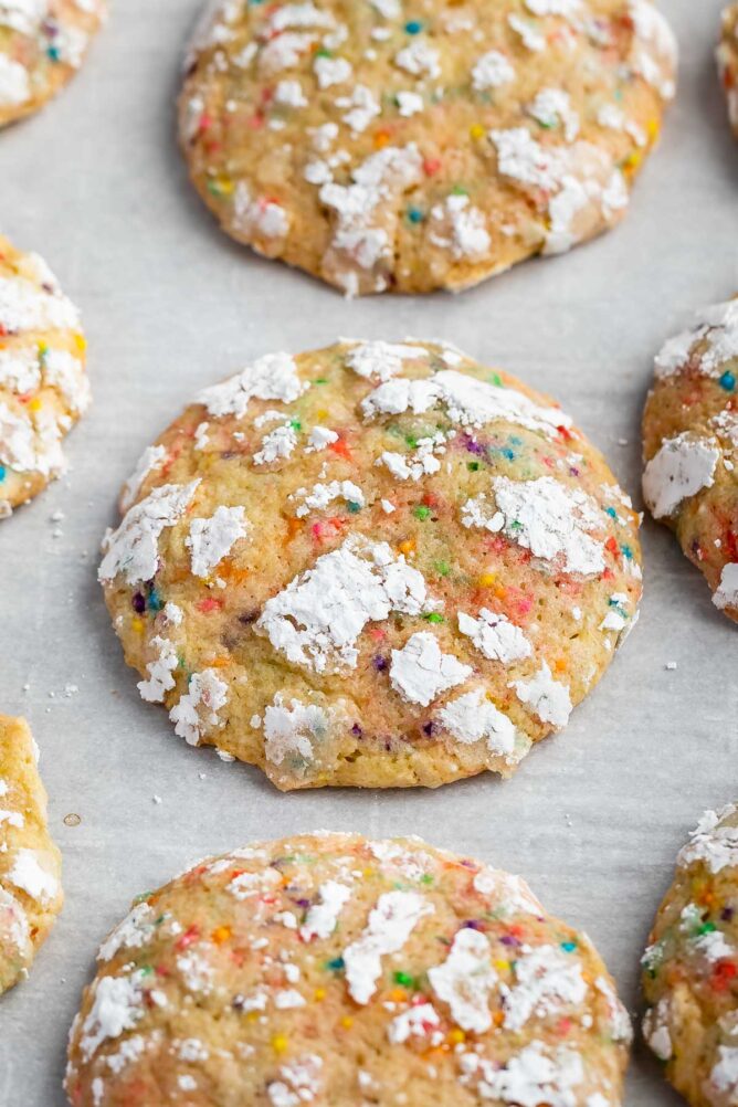 Close up shot of funfetti crinkle cookies on parchment paper