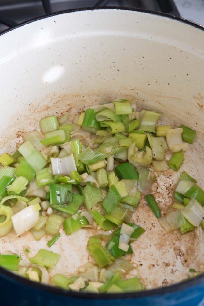 Leeks in the dutch oven after bacon was cooked