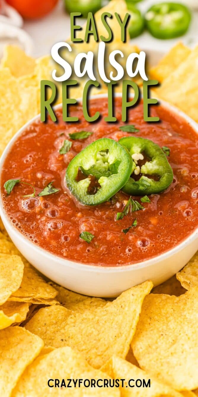 One bowl of easy salsa topped with sliced jalapenos surrounded by tortilla chips and recipe title on top of image
