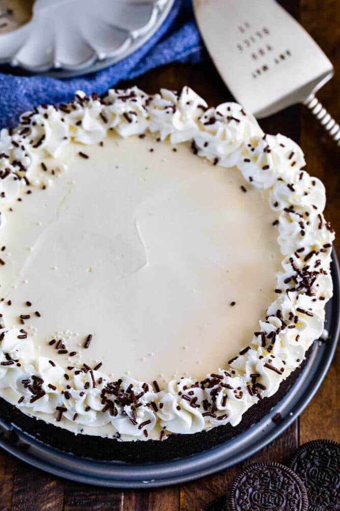 overhead of full cheesecake with whipped cream and sprinkles