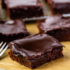 A bunch of double fudge brownies on parchment paper