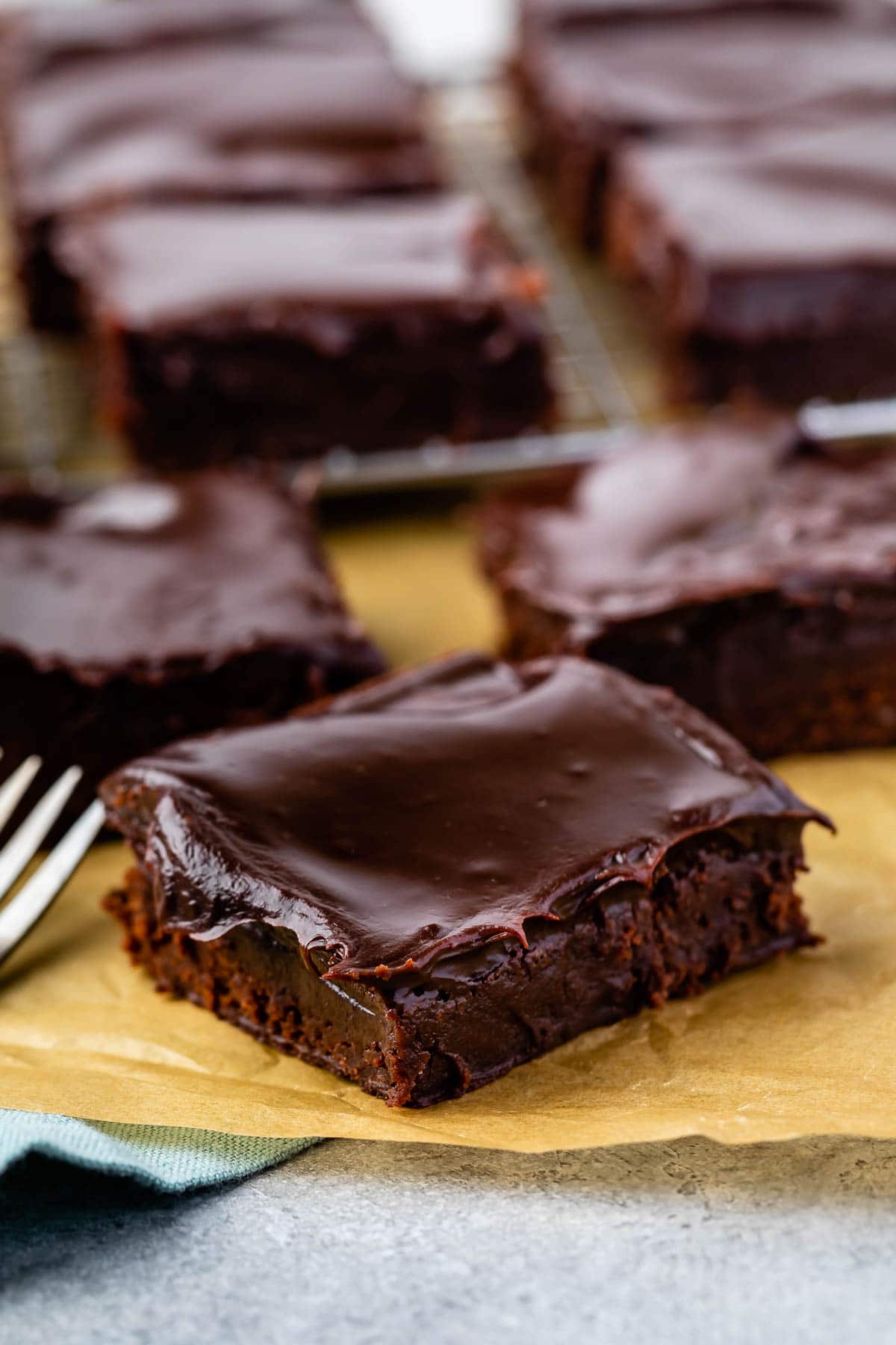 A bunch of double fudge brownies on parchment paper