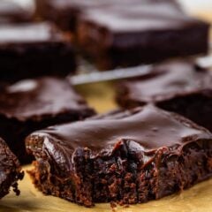 Close up shot of a double fudge brownie with corner bite missing