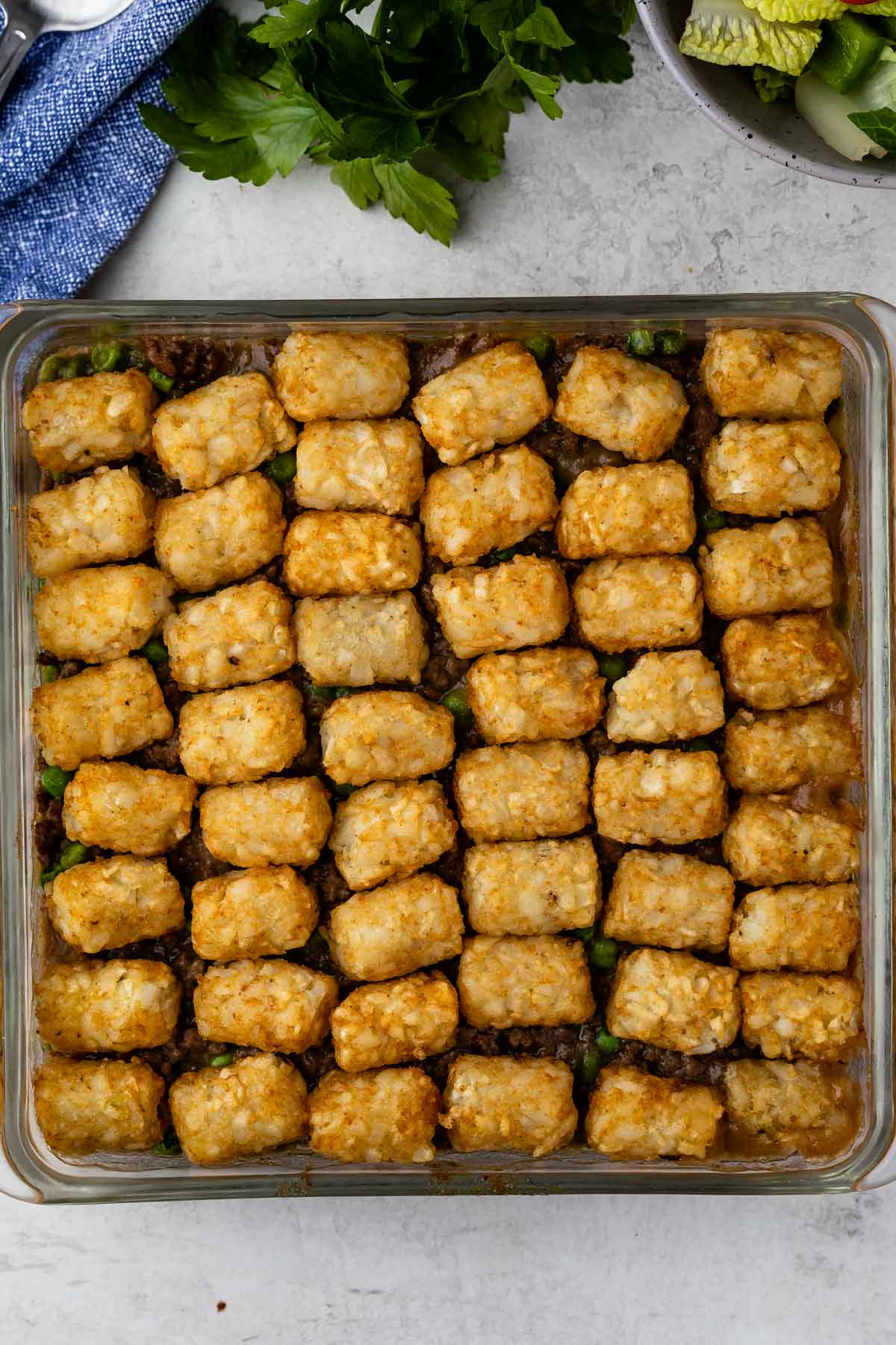 Overhead shot of tater tot hamburger casserole with gravy