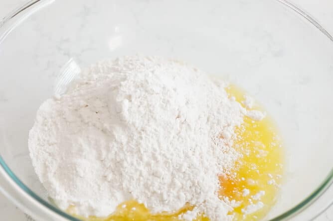 bowl of cake mix with eggs and oil and water