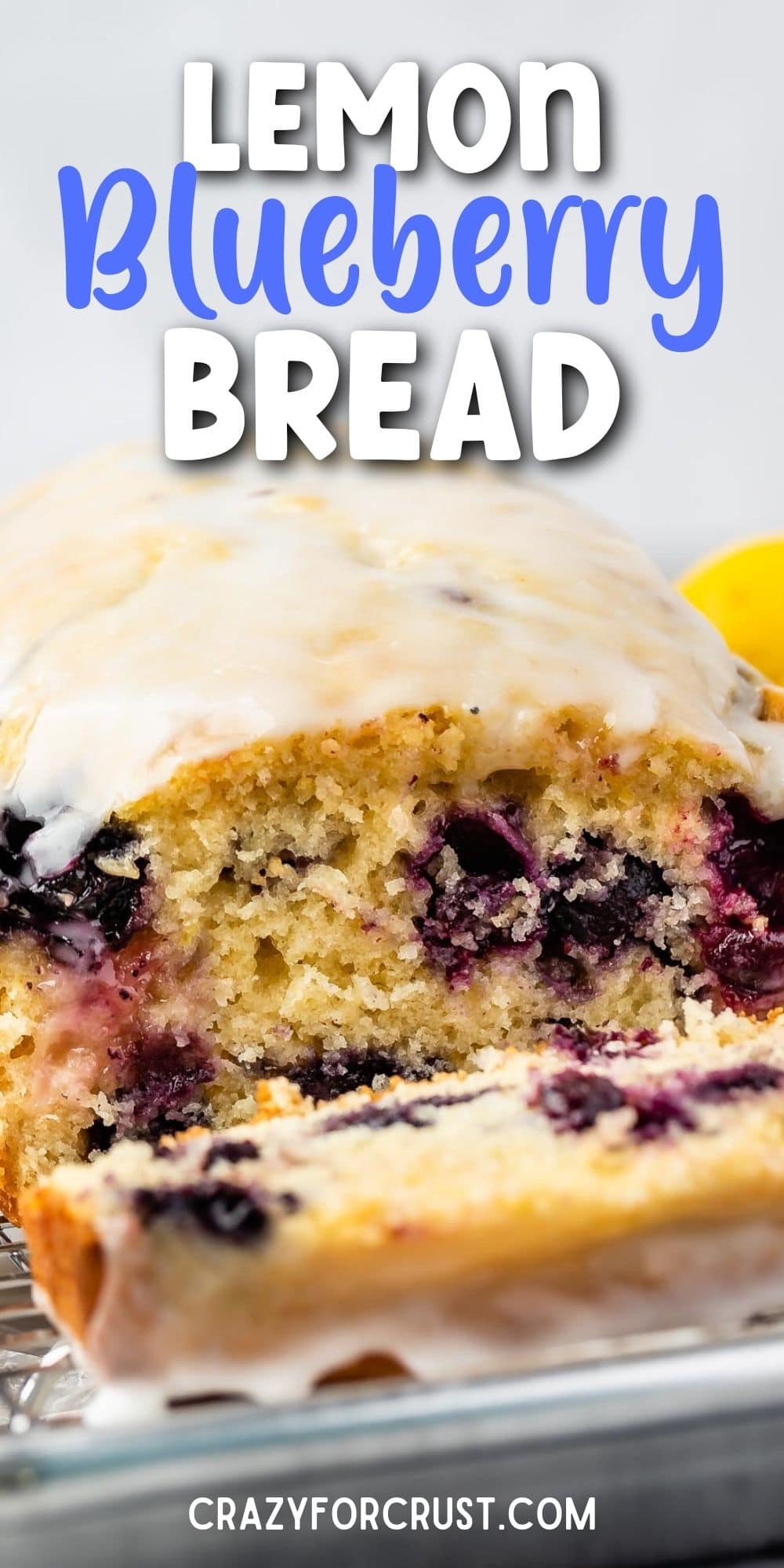 Lemon blueberry loaf with one slice cut off and recipe title on top of image