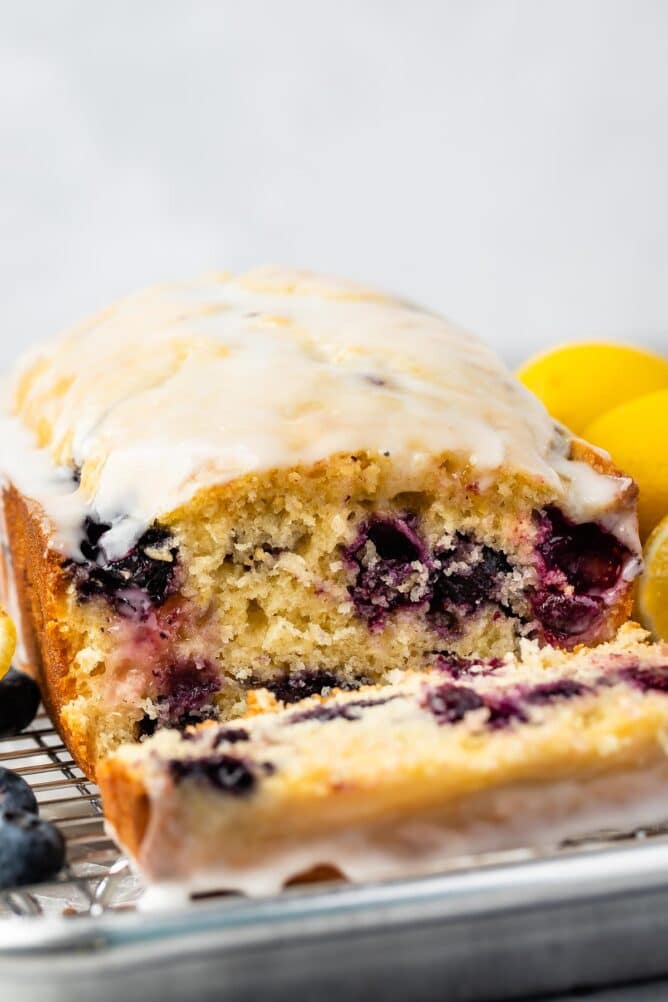 Lemon blueberry loaf with one slice cut off
