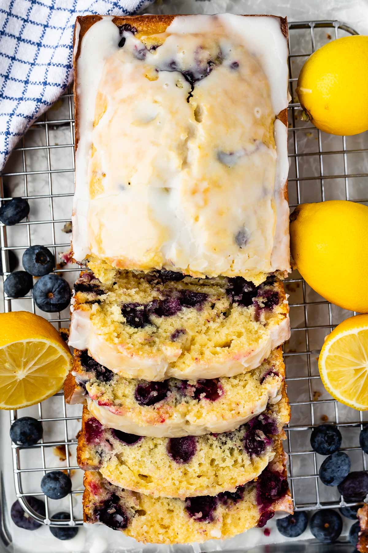 Overhead shot of lemon blueberry bread loaf cut into slices