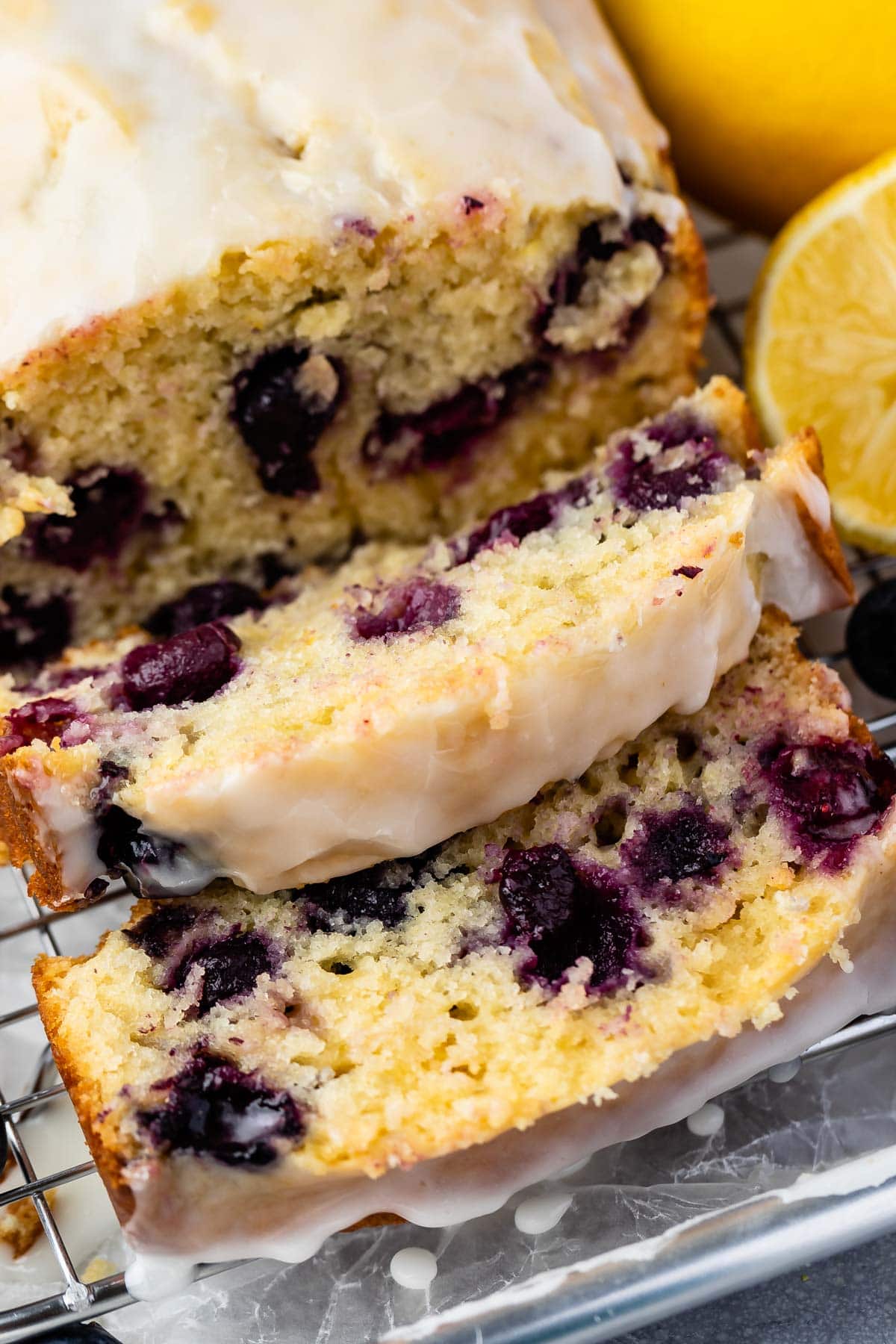 Overhead shot of lemon blueberry loaf with two slices cut off