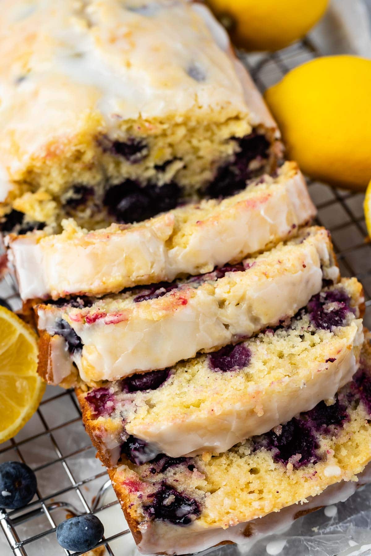 Overhead shot of lemon blueberry bread loaf cut into slices