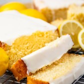 Lemon pound cake with two slices cut off on a metal wire rack