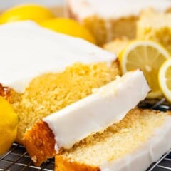 Lemon pound cake with two slices cut off on a metal wire rack