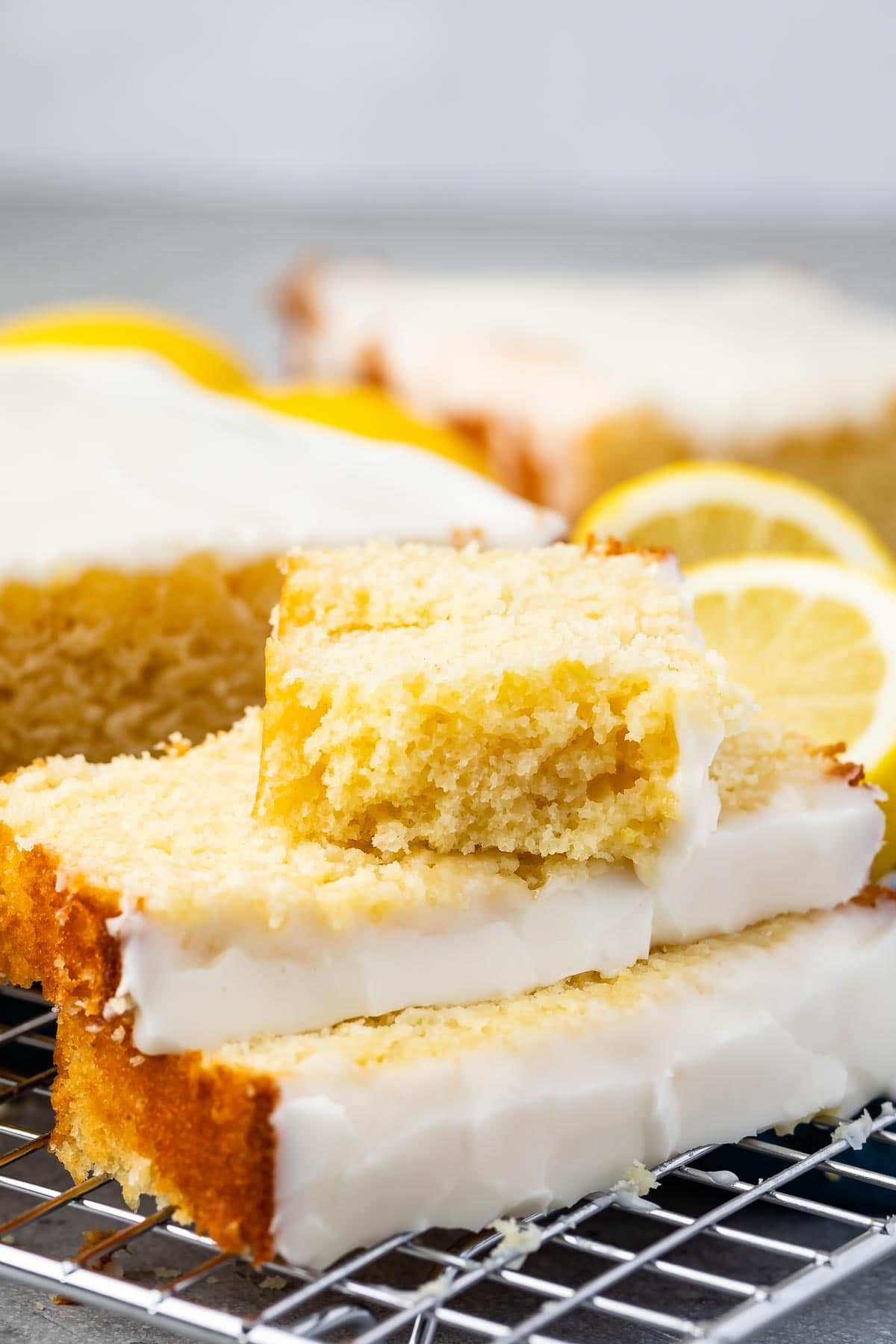 Lemon pound cake slices stacked on top of eachother
