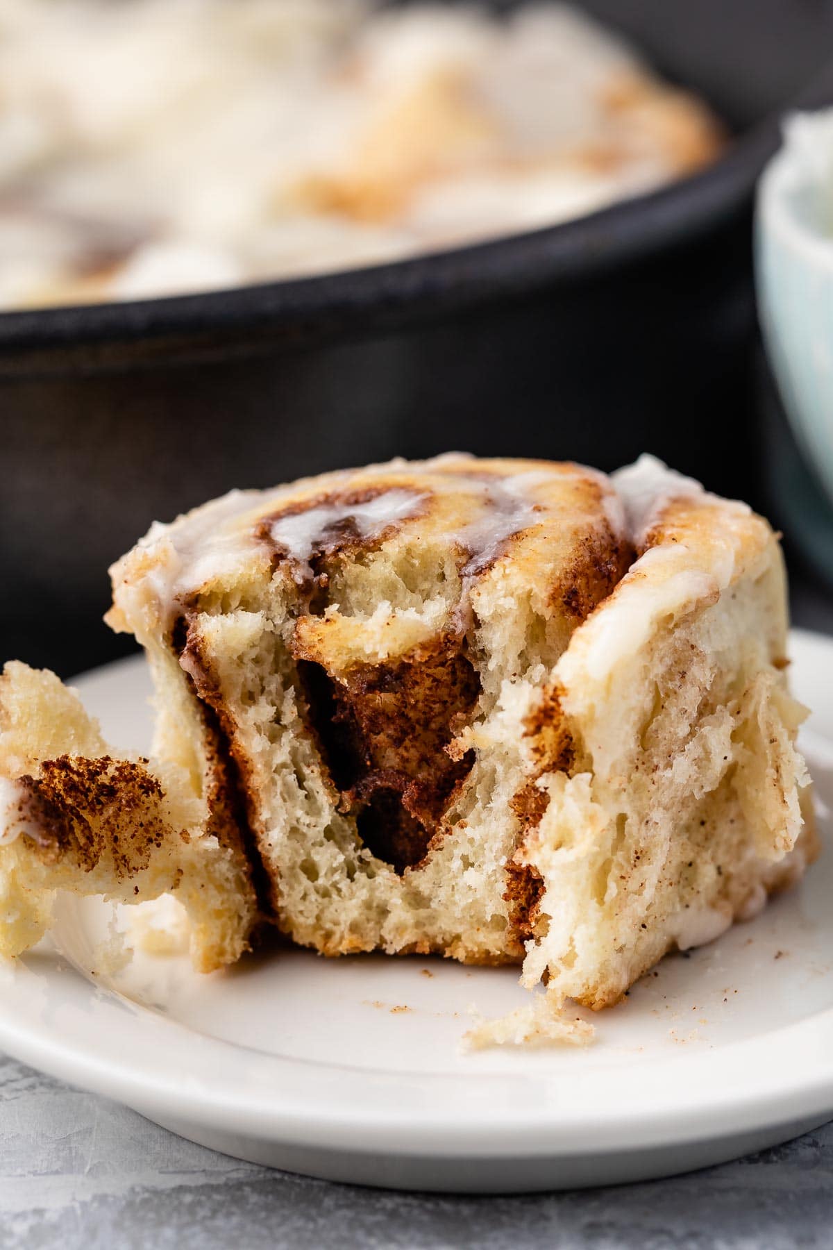 sliced open cinnamon roll on plate