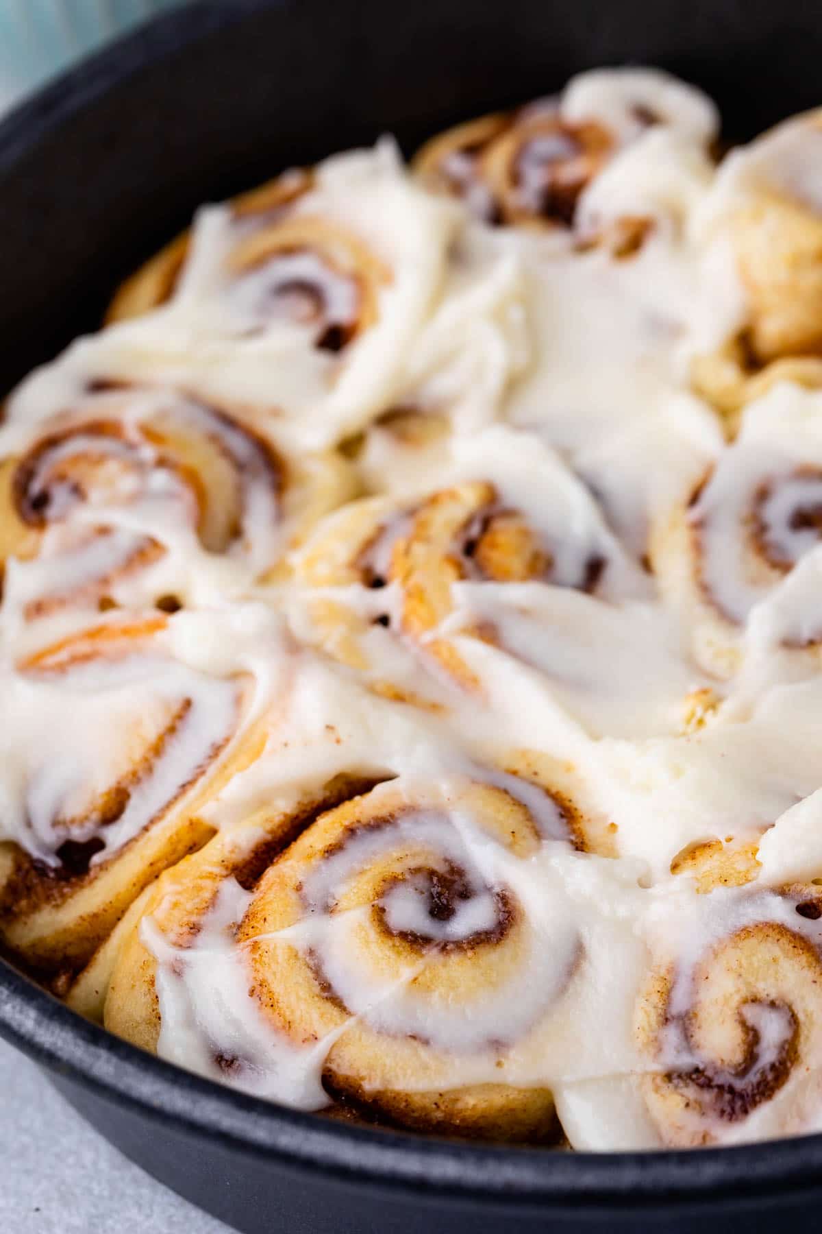 These Small Batch Cinnamon Rolls are on your table in under one hour! Quick and sinful, just like they should be. cinnamon rolls in pan