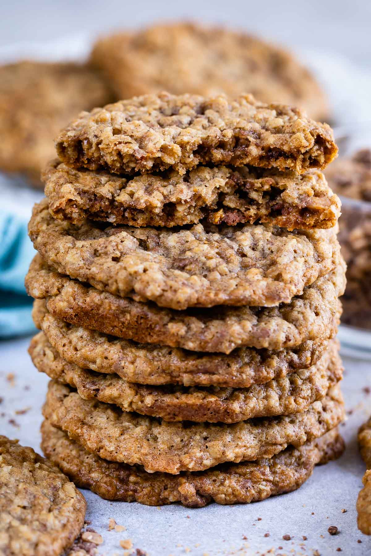Stack of oatmeal toffee cookies with top cookie split in half