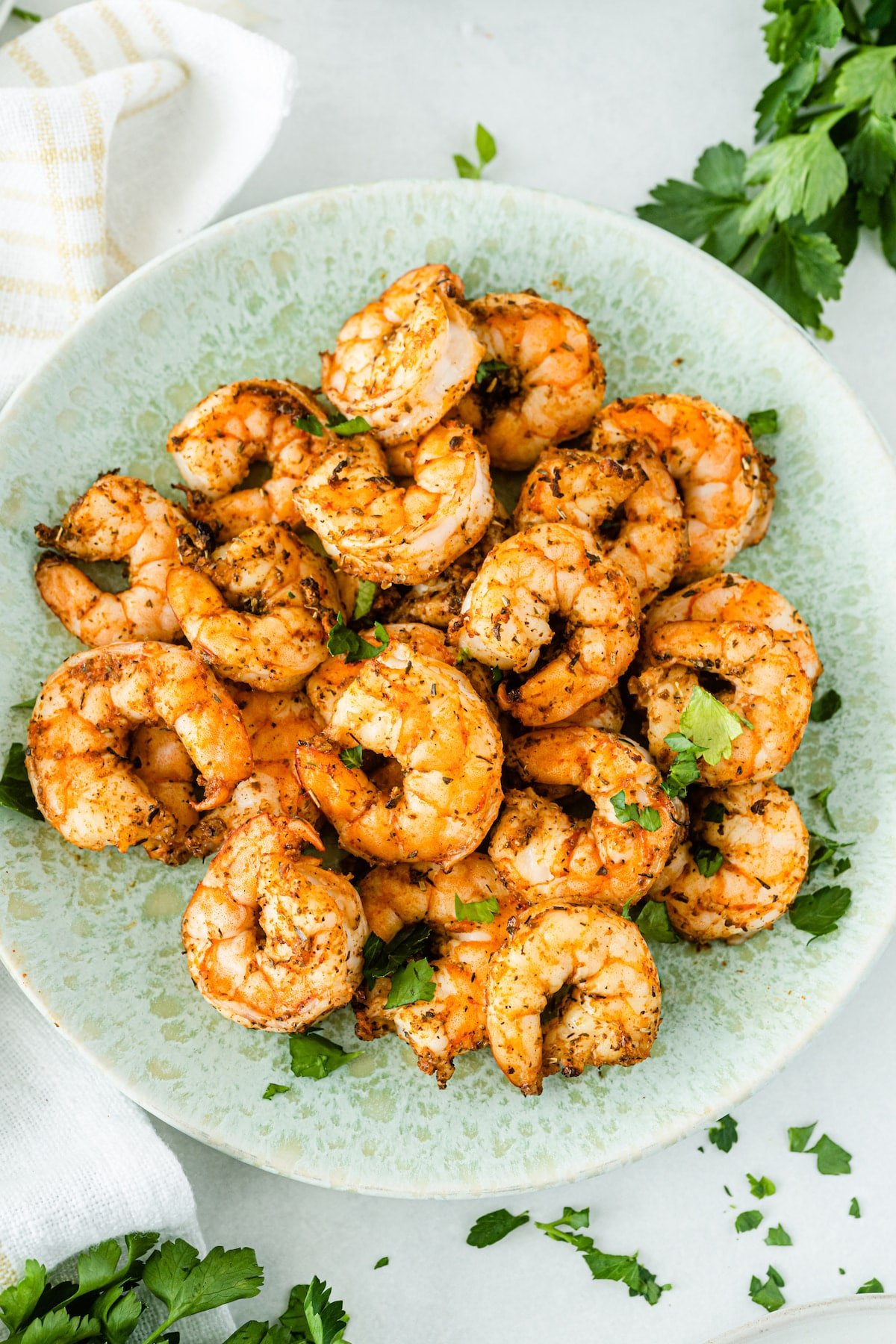 Overhead shot of plate full of air fryer shrimp