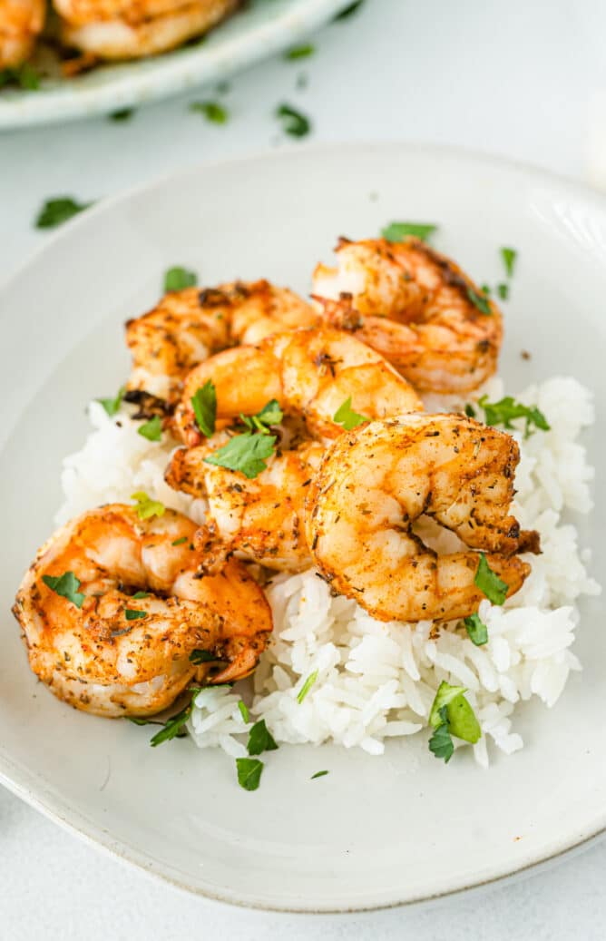 Air fryer shrimp served on a bed of white rice